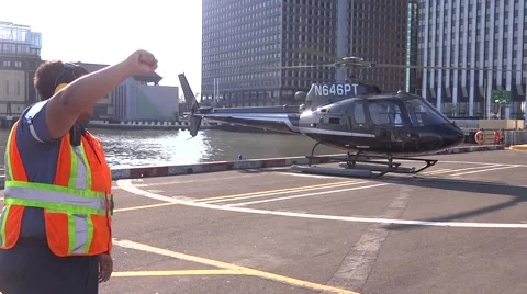 Heliport worker directing pilot Stock Footage 51839113