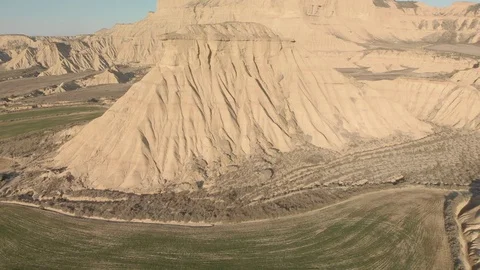 Helix Flight down Hills and Fields in Bardenas Reales Navarra Stock Footage 103320603