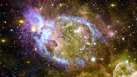 The Helix Nebula in deep space. Elements of this image furnished by NASA. Stock Photos