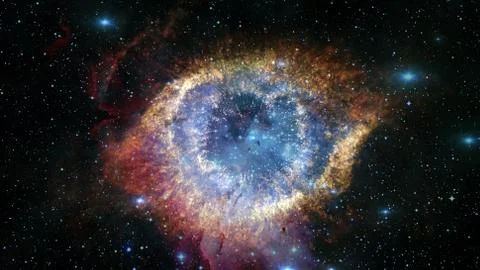 The Helix Nebula in space. Elements of this image furnished by NASA. Stock Photos