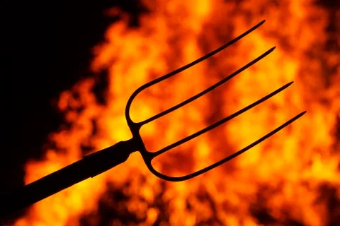 Hell fork on the background of fire 스톡 사진