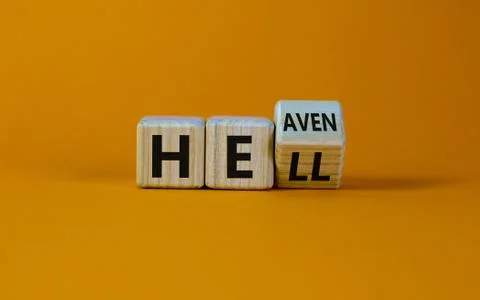 Hell or heaven. Turned a cube and changed the word 'hell' to 'heaven'. Concep Stock Photos