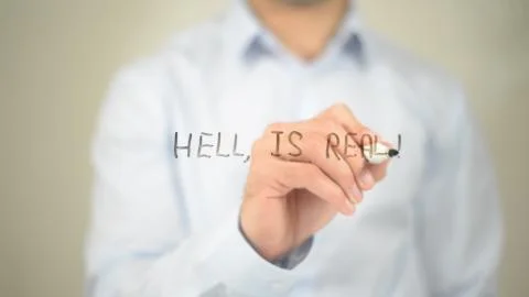 Hell is Real , Man writing on transparent screen 스톡 사진