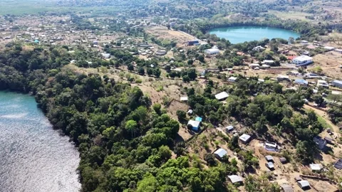 Hell Ville and the nearest volcanic lakes Lac Djabala and Ampombilava, Nosy be Stock Footage 325642801
