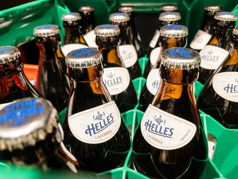 Helles Lager Beer Bottles in Crate Display Stock Photos