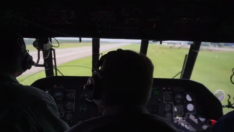 Hellicopter taking off, view from inside with pilots Stock Footage 80395193