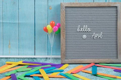 Hello april poster on grey background Stock Photos