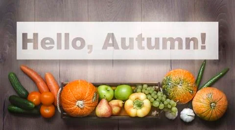 Hello, Autumn Text , background of pumpkins and fruits and vegetables Stock Photos