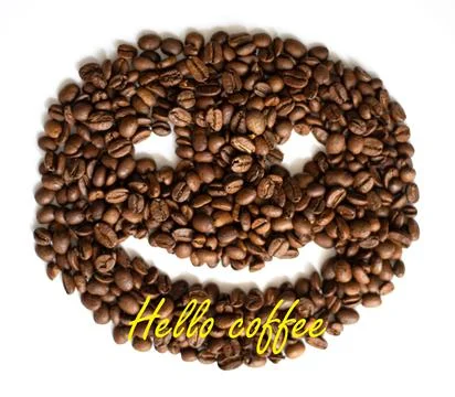Hello coffee. Closeup of roasted coffee beans with smile on white background Stock Photos