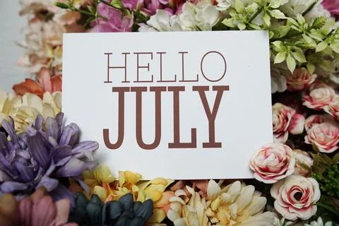 Hello July text message on paper card with beautiful flowers decoration Stock Photos
