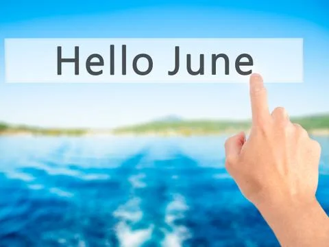 Hello June - Hand pressing a button on blurred background concept on visual s Stock Photos