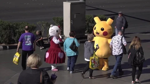 Hello Kitty and Pikachu greeting fans on Las Vegas streets 4k Stock Footage 72719411