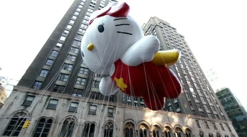 Hello Kitty balloon in sky at Macy's handheld Stockbeeldmateriaal 10572878