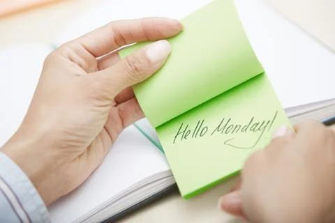 Hello Monday text on adhesive note Stock Photos