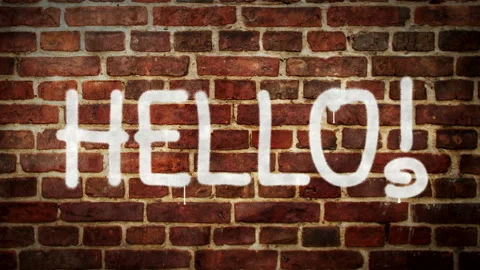 Hello sign spray painted on the brick wall Stock Footage 150829616