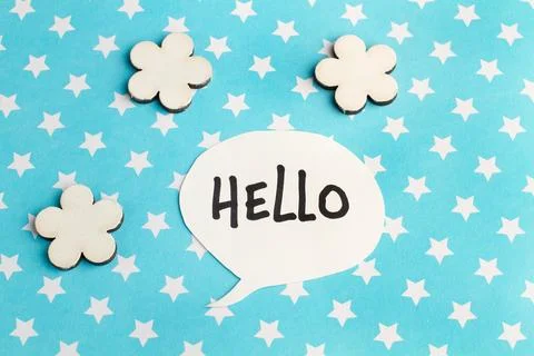 Hello speech bublle on a light blue background with white stars Foto stock