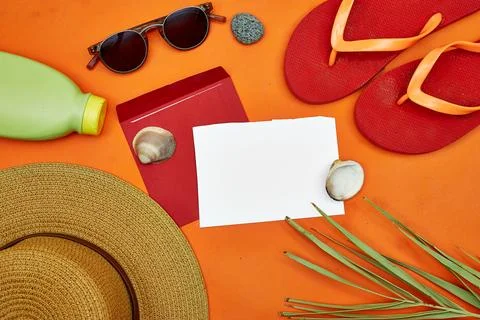 Hello Summer Flat Lay With Straw Hat, Flip-Flops, Sunglasses, Shells and Sunscre Stock Photos
