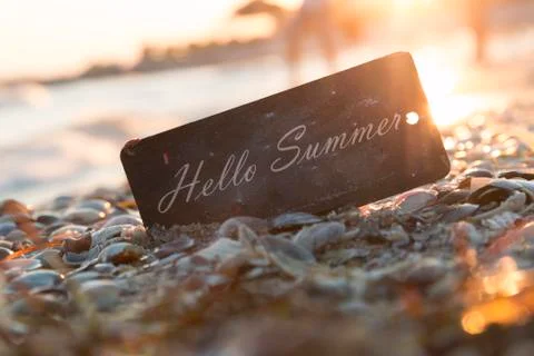 Hello Summer text and sunset on the beach Stock Photos