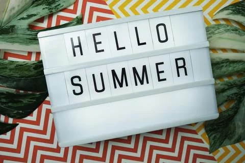 Hello Summer word in lightbox with Monstera Leaves decoration Stock-Fotos