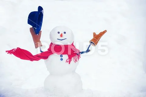 Hello winter. Happy snowman standing in winter Christmas landscape. Happy Stock Photos