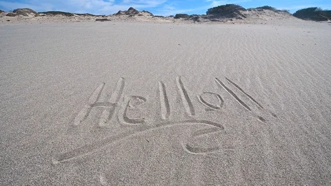 Hello!! zoom written on sand Stock Footage 103620108