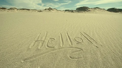 Hello!! zoom written on sand Stock Footage 103622036