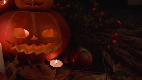 Helloween. Composition pumpkins,candles,leaves,apples, wild rose. Stock Footage 80934501