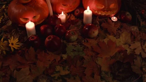 Helloween. Composition pumpkins,candles,leaves,apples, wild rose. Stock Footage 80946540