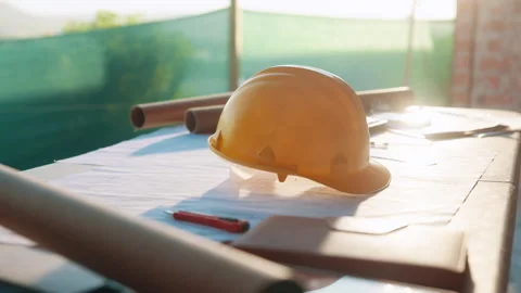Helmet, architecture and blueprint on table with safety documents, construction Stock Footage 336200311