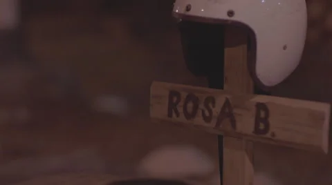 Helmet on a cross in grave Stock Footage 61771048