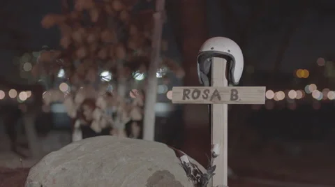 Helmet on a cross in grave Stock Footage 61772564