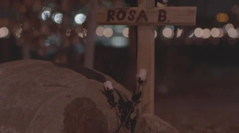 Helmet on a cross in grave Stock Footage 61772597