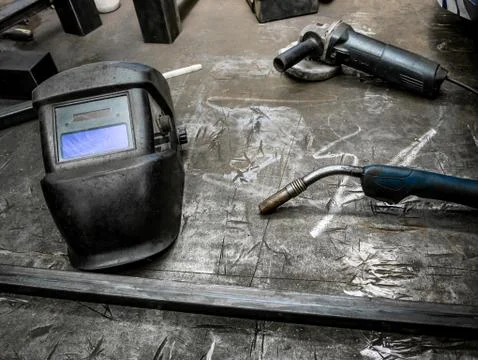 Helmet for welding on a locksmiths table Stock Photos