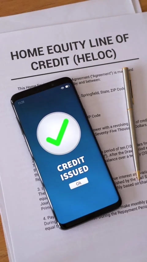 HELOC loan approved. Concept of taking a Home Equity Line Of Credit. Vertical Stock Footage 308994286