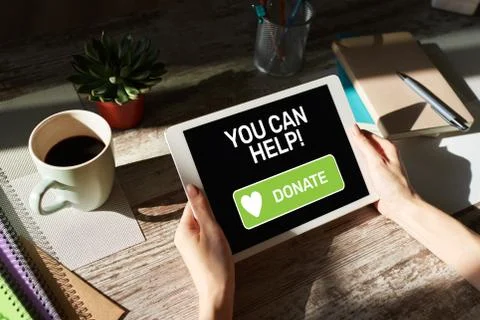 Help and donation button on device screen. 库存照片