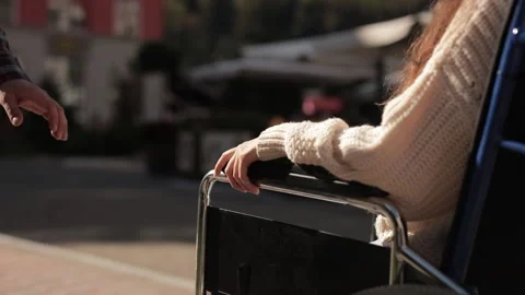 Help and support for disabled invalid people. Man put his hand on hand of Stock Footage 221456959