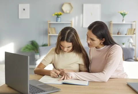 Help and support from mother with daughters homework and learning challenges Stock Photos