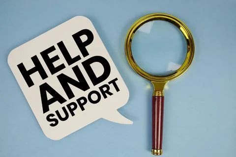 Help and Support text with magnifying glass on blue background 스톡 사진