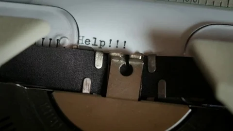 HELP being typewritten Stock Footage