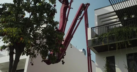With the help of the boom of a special machine. Pouring ready-mixed concrete Stock-Footage 306961970