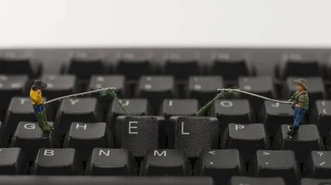 Help computer hacking little people hacking computer keyboard help Copyrig... Stock Photos