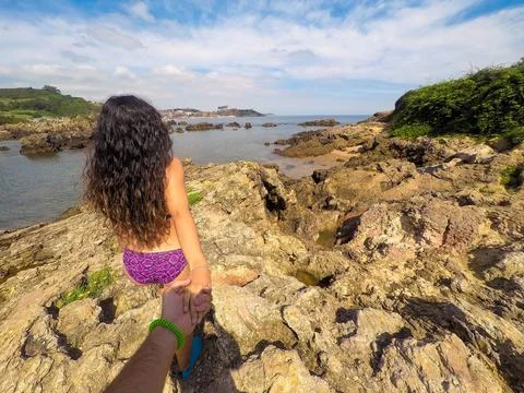 Help concept. Couple walking together in the sea. Concept of help. Man follow Stock Photos