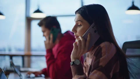 Help desk managers calling cellphones handling requests at laptops closeup. Stock Footage 340110069
