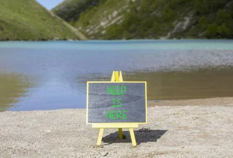 Help is here and support words symbol. Concept words Help is here on beauti.. Stock Photos