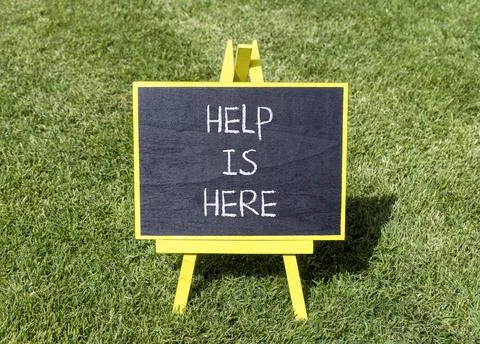 Help is here and support words symbol. Concept words Help is here on beauti.. Stock Photos
