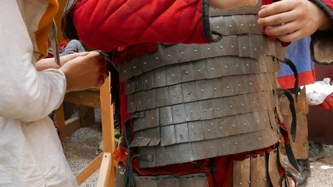 Help knight put on chain mail armor Stock-Footage 123584109