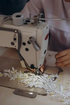 With the help of machine the designer is creating a new ornament. Stock Photos