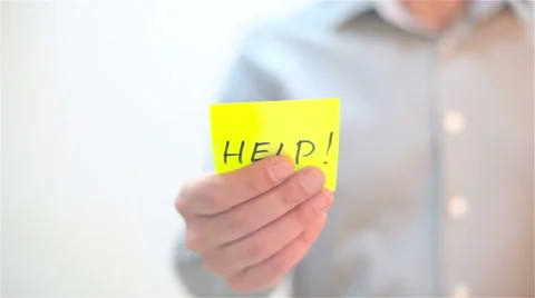 Help. A man sticks a note on transparent screen Stock Footage 68088583