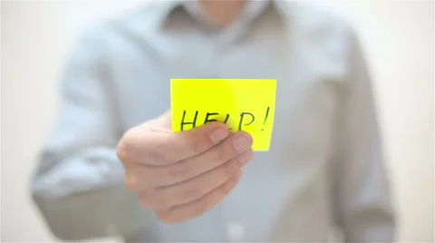 Help. A man sticks a note on transparent screen Stock Footage 68088785
