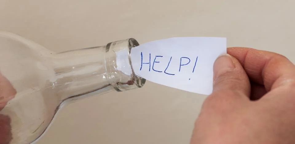 Help message in a bottle Stock Photos